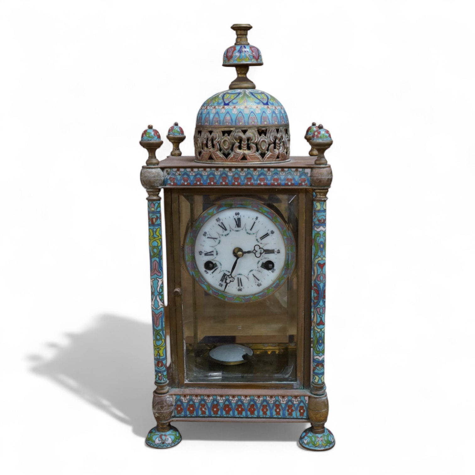 A reproduction champleve enamel and brass mantel clock, 49cm high. Condition - fair